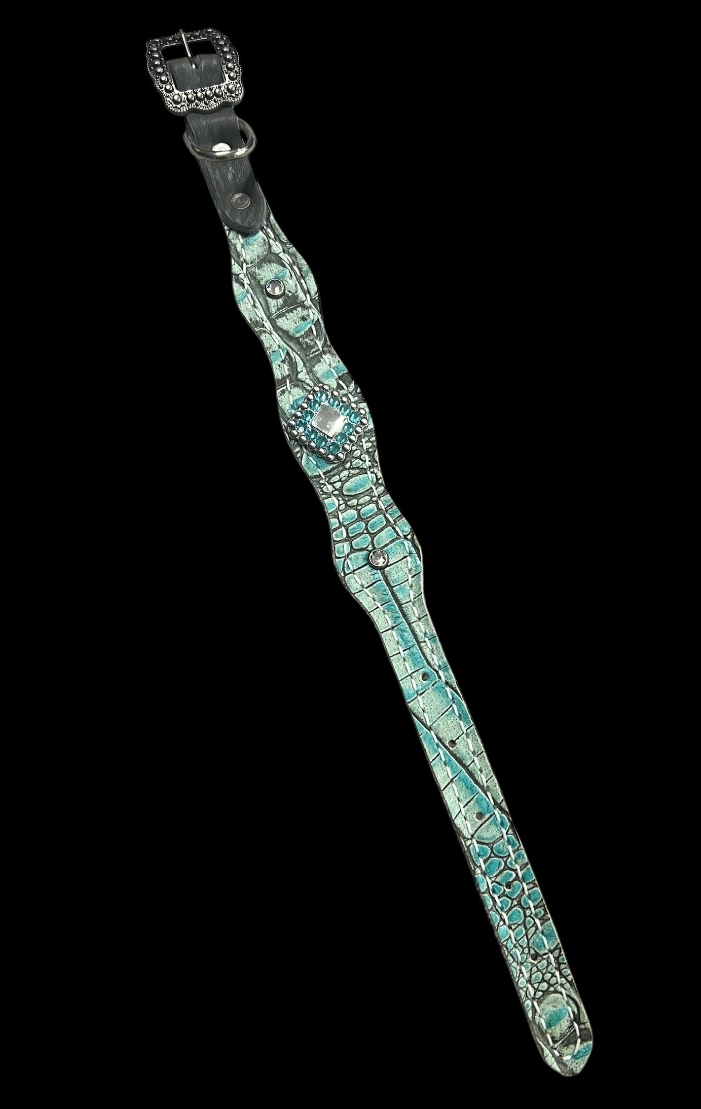 Antique turquoise gator on dark leather