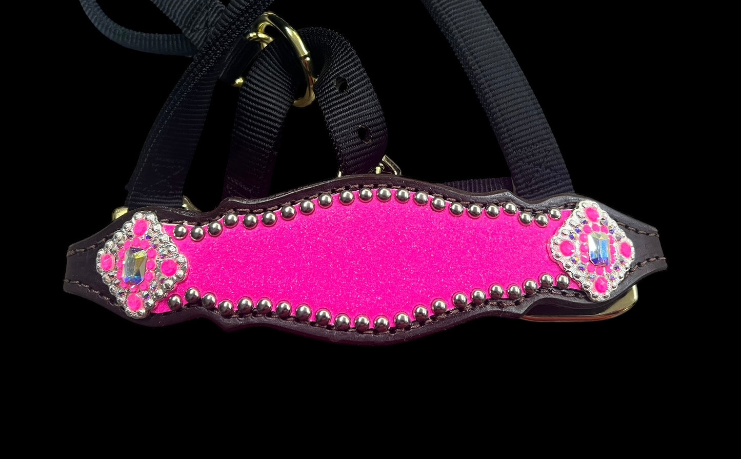 Hot pink glitter on dark leather