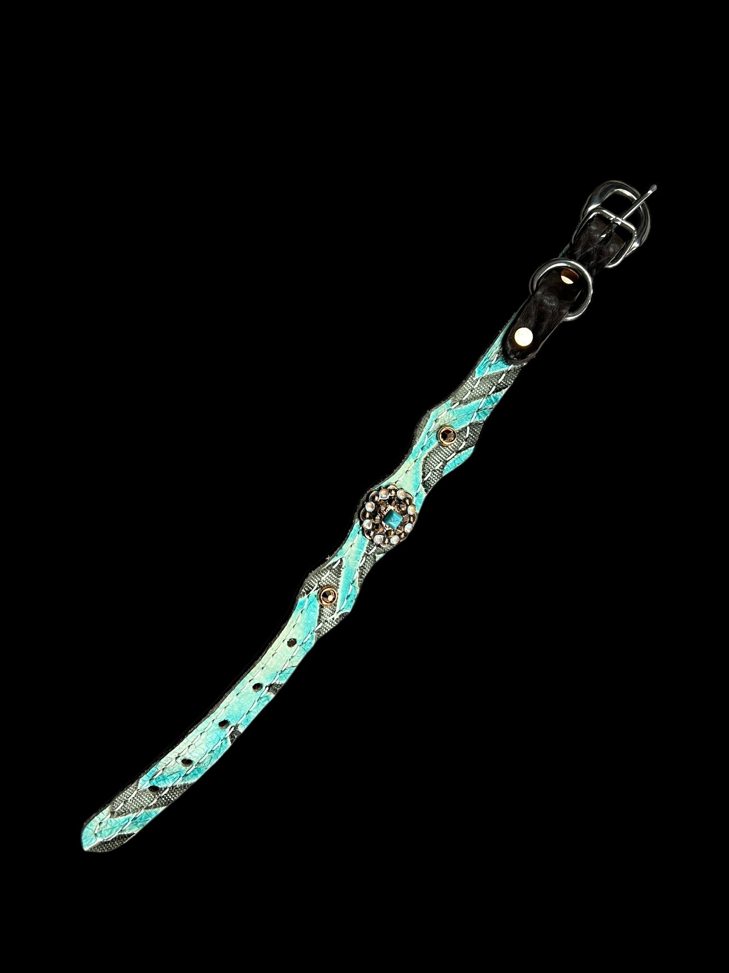 Light turquoise Laredo on dark leather