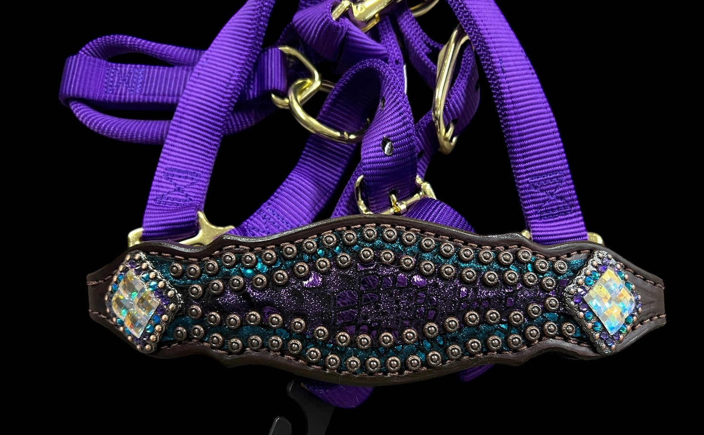 Teal and purple mystic on dark leather