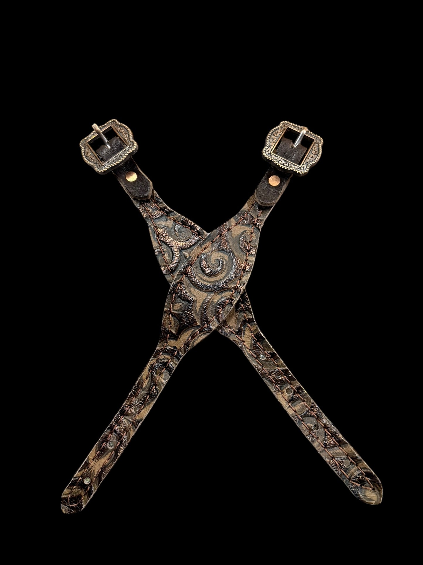 Brown swirl on dark leather