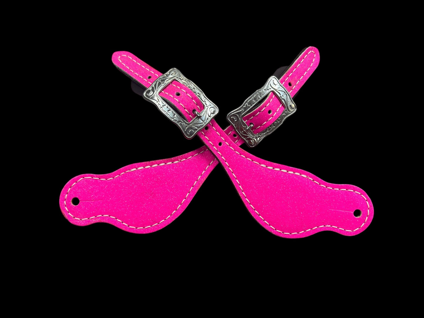Hot pink glitter on dark leather