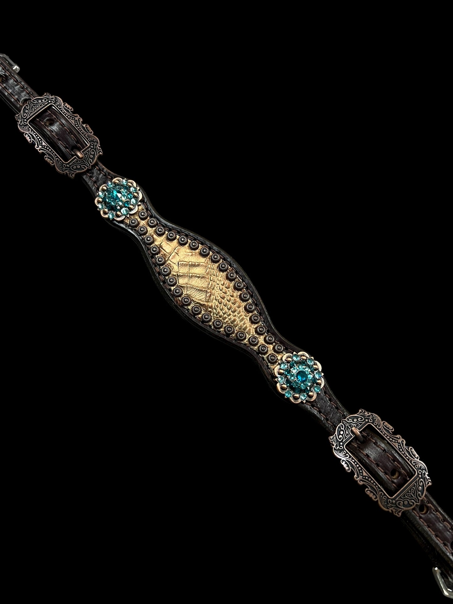 Brown and teal gator on dark leather