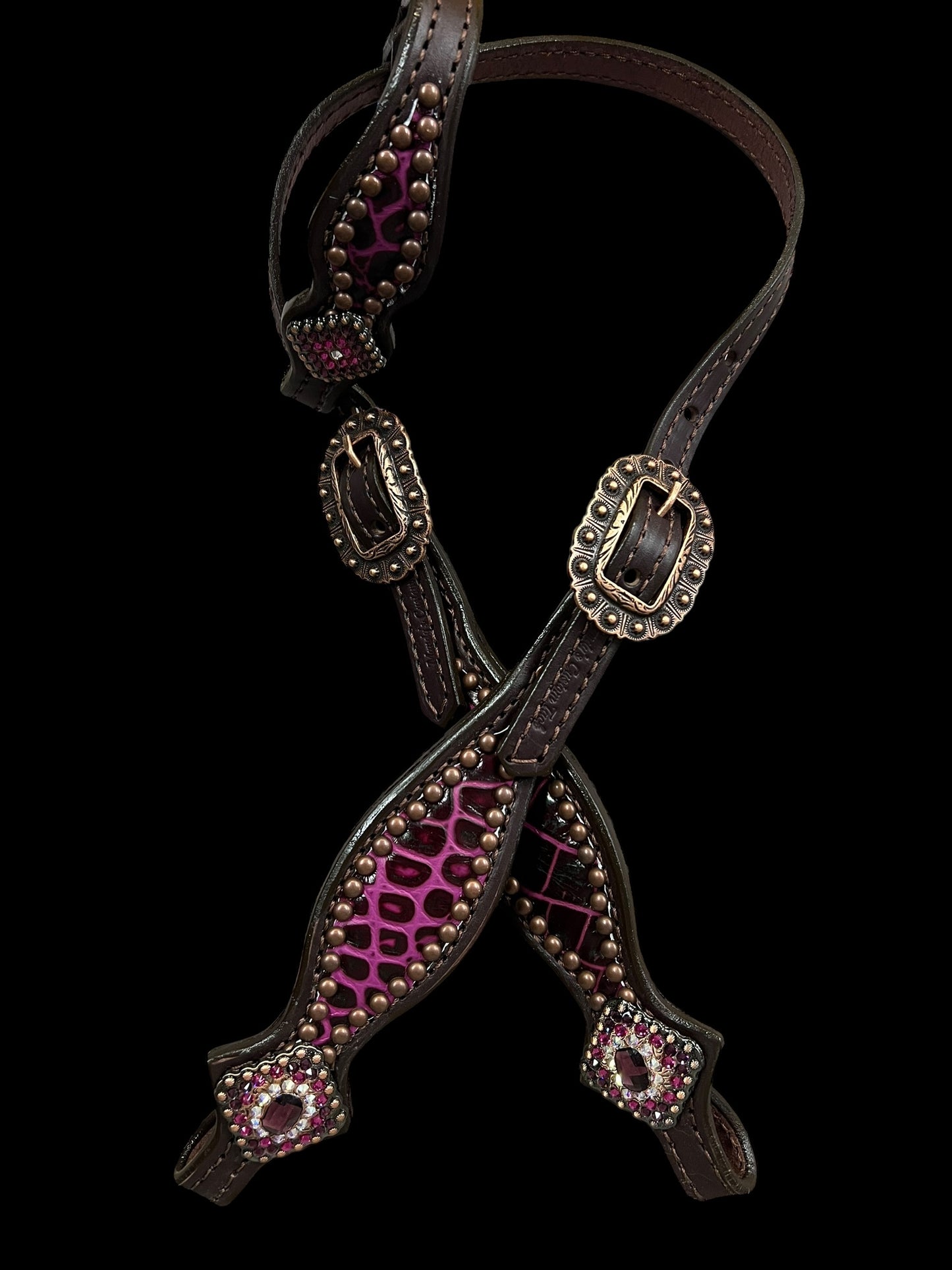 Fuchsia gator on dark leather