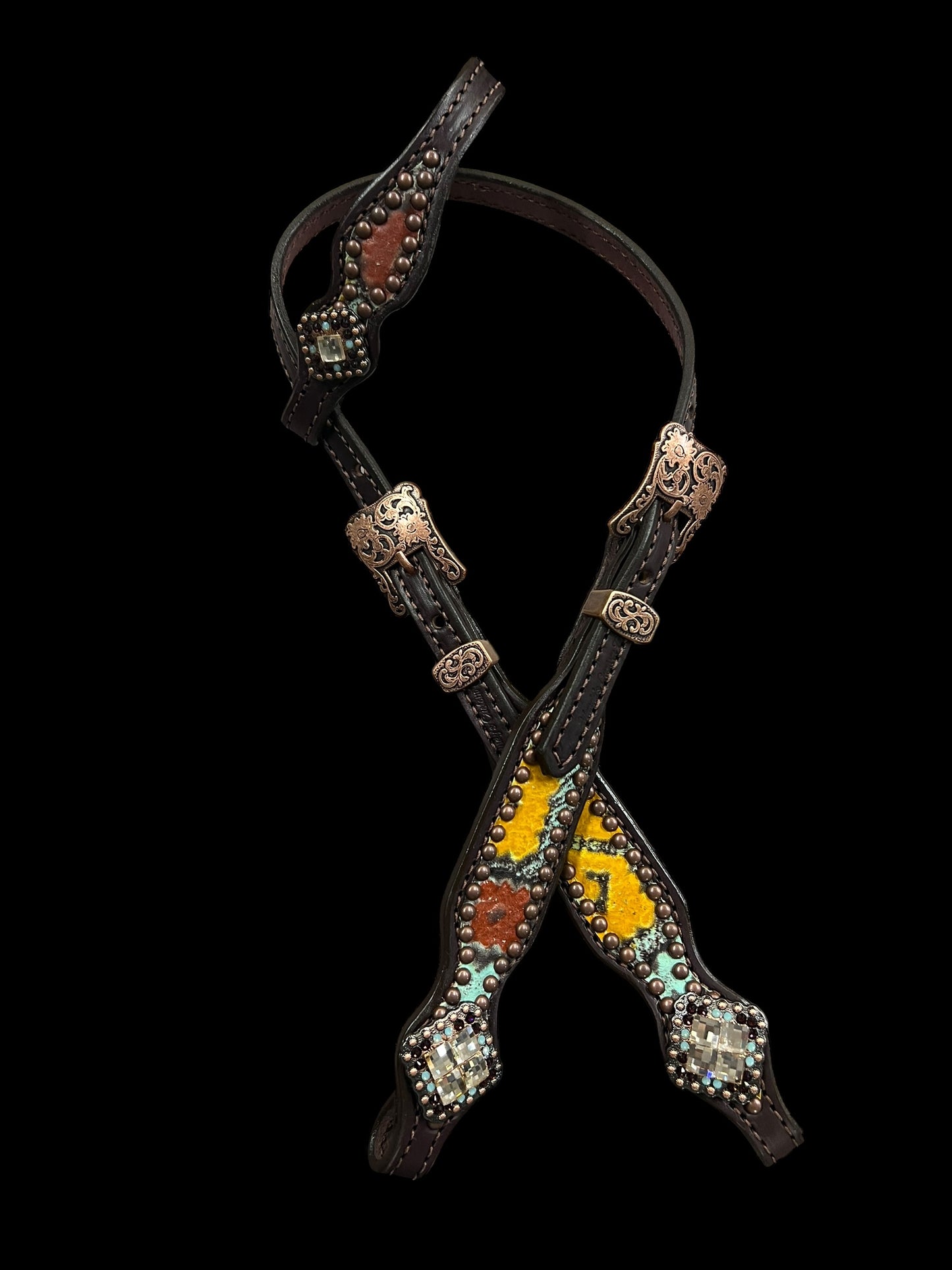 Yellow, mint, and brick red Taos on dark leather
