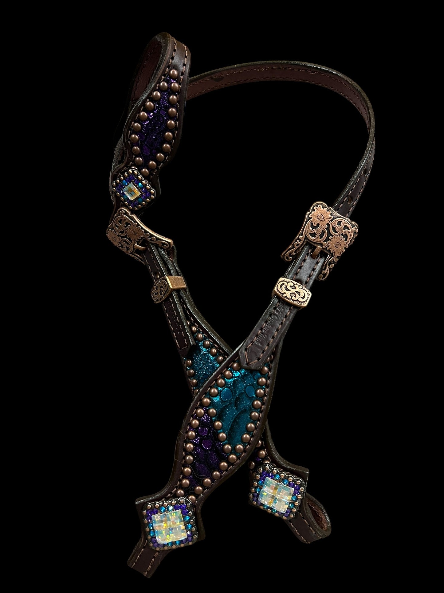 Teal and purple mystic on dark leather
