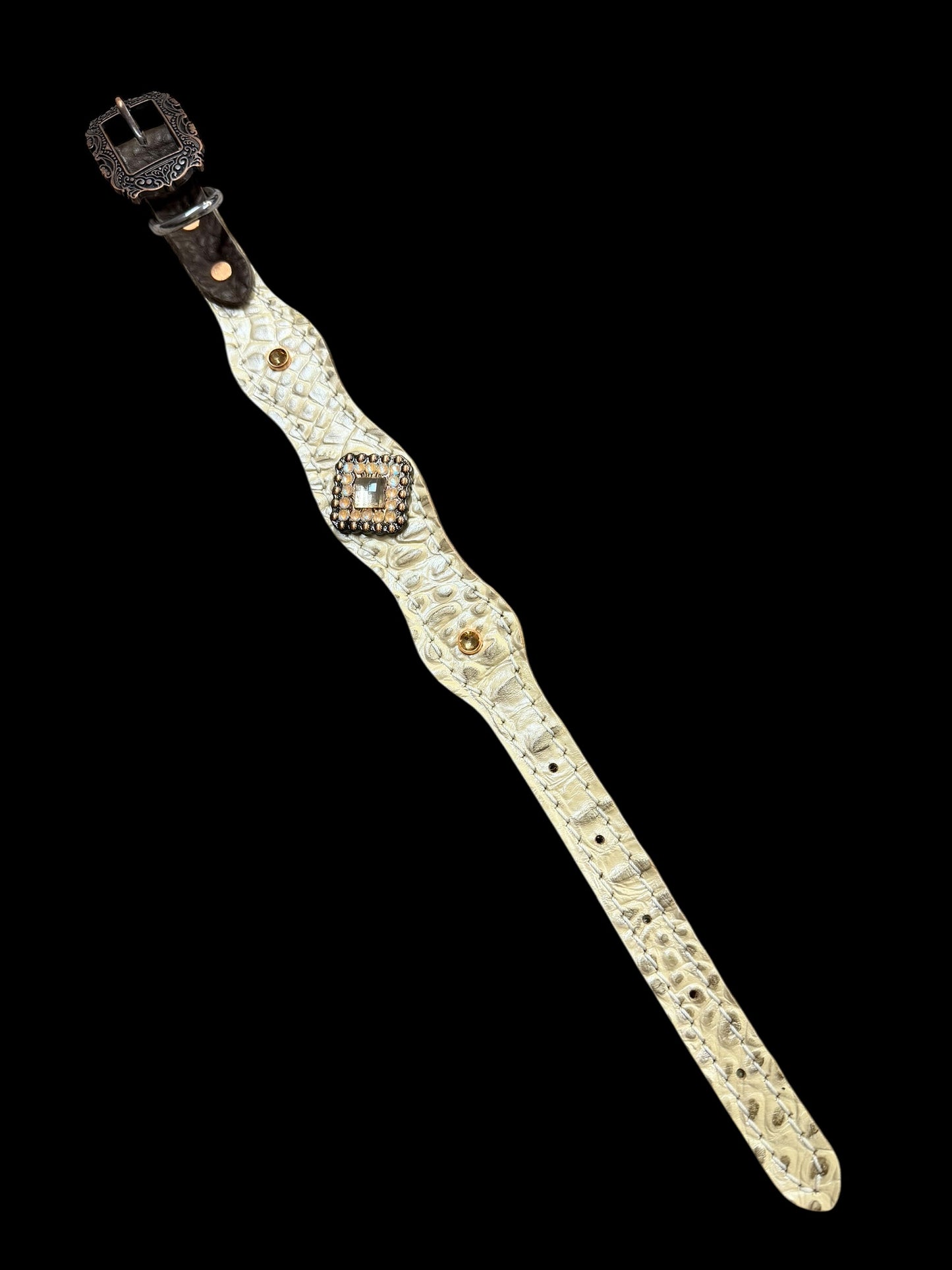 Champagne gator on dark leather