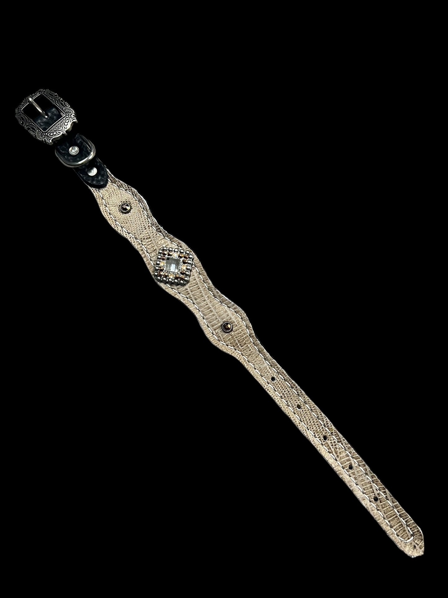 copper lizard on dark leather