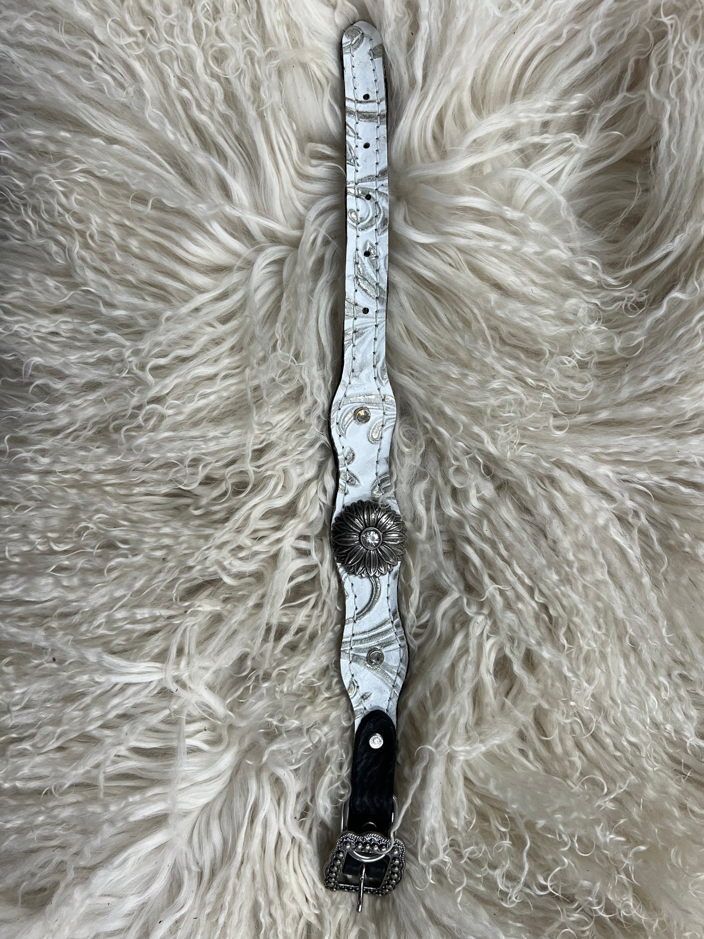 White and silver floral on dark leather