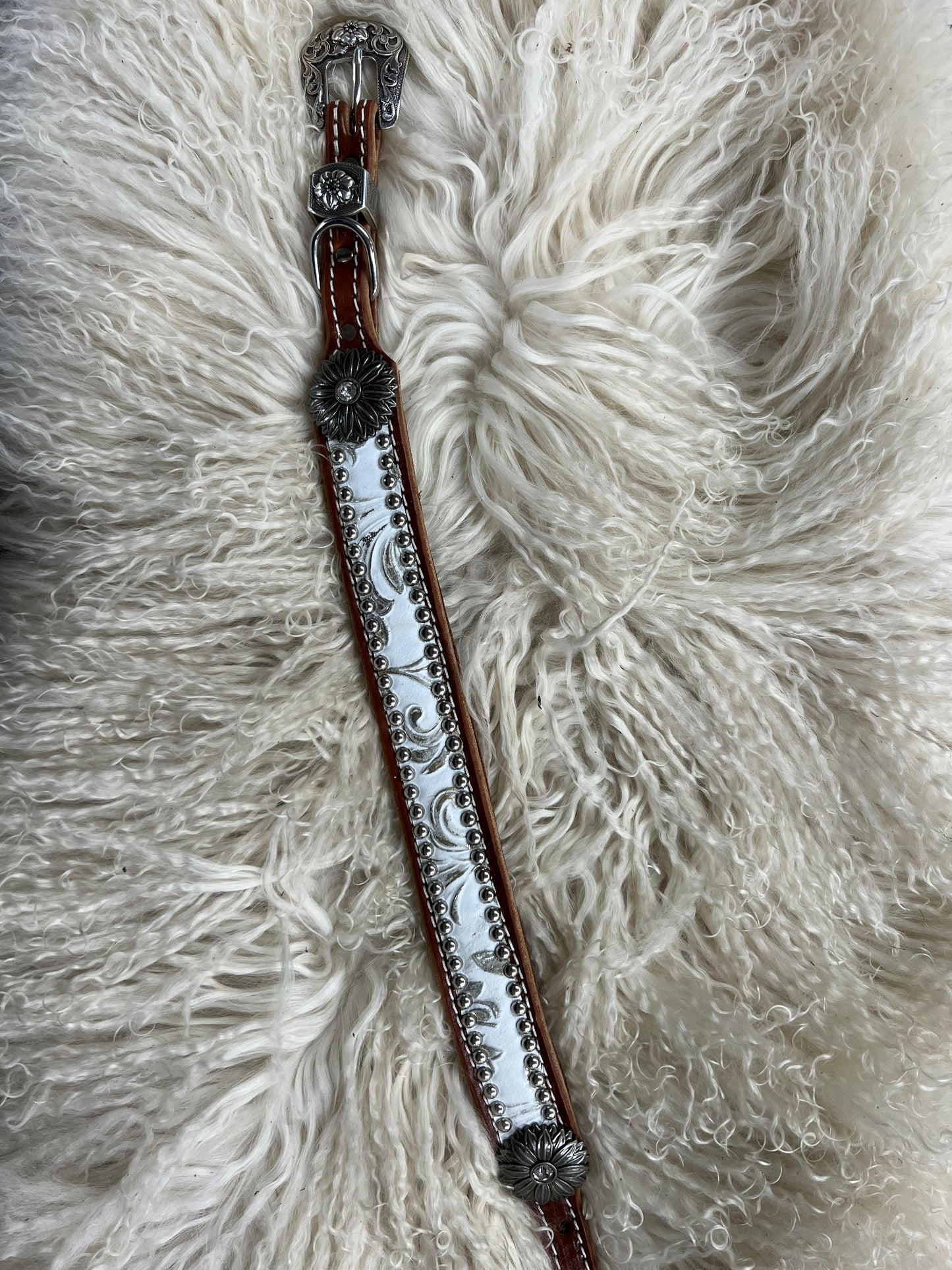 White and silver floral on dark leather