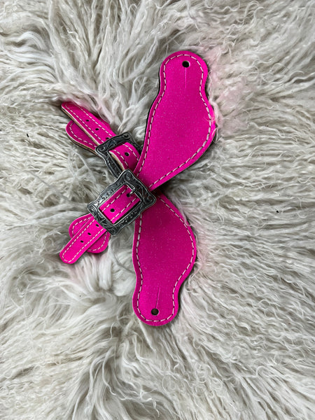 Hot pink glitter on dark leather
