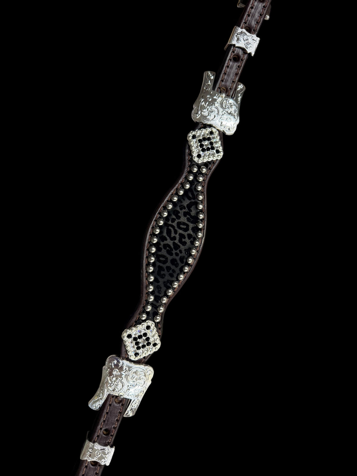 Black flocked leopard on dark leather