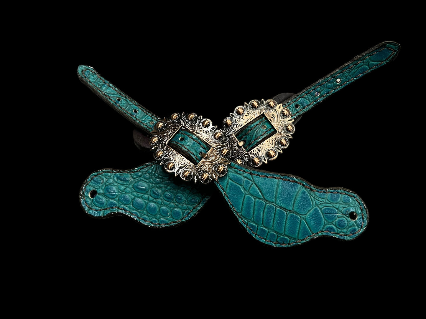 Teal gator on dark leather