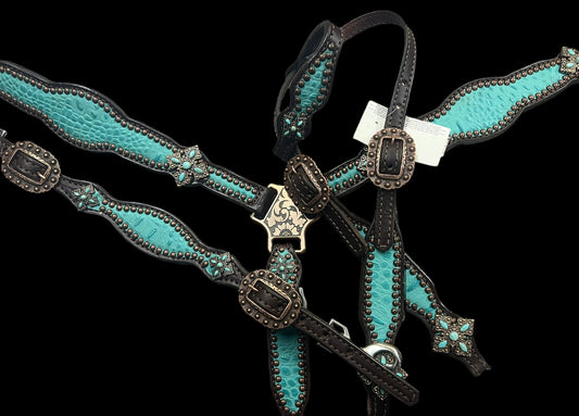 Turquoise gator on dark leather