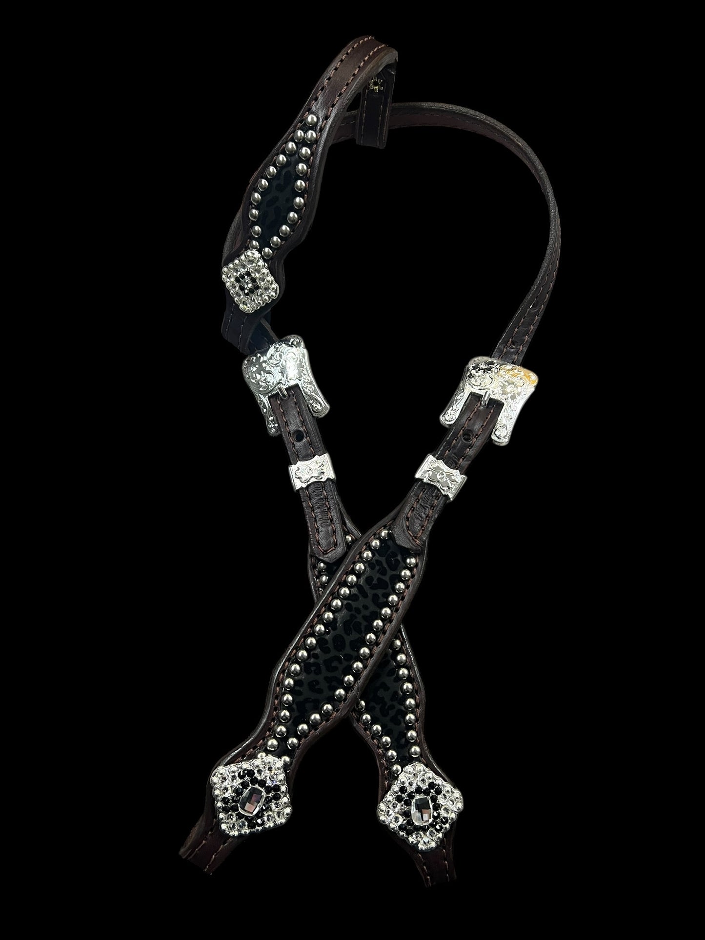 Black flocked leopard on dark leather