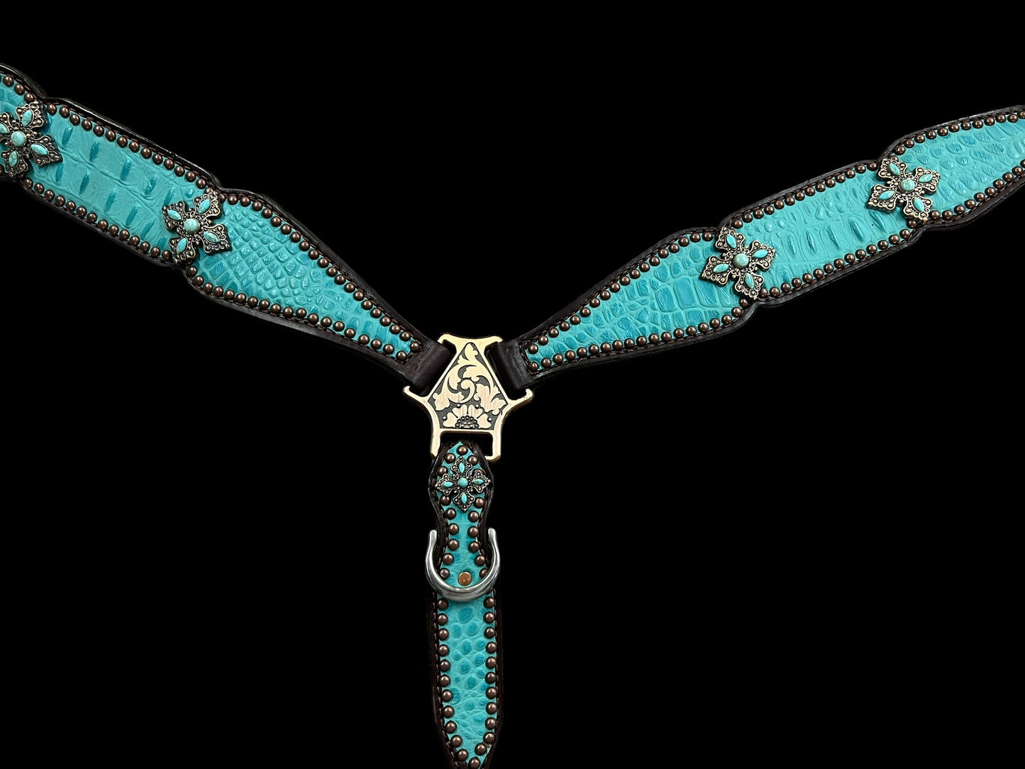 Turquoise gator on dark leather