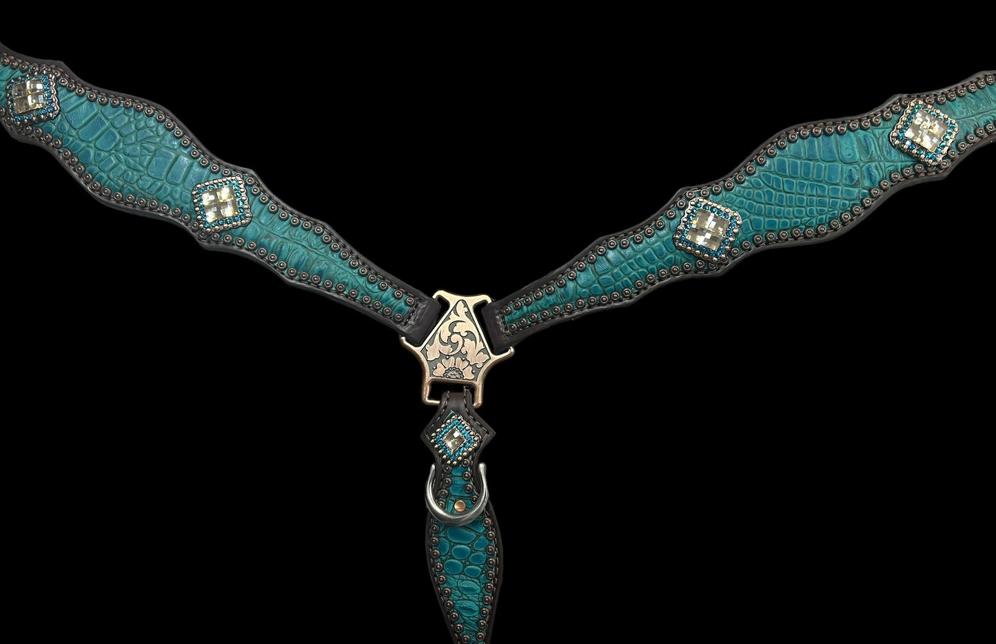 Teal gator on dark leather