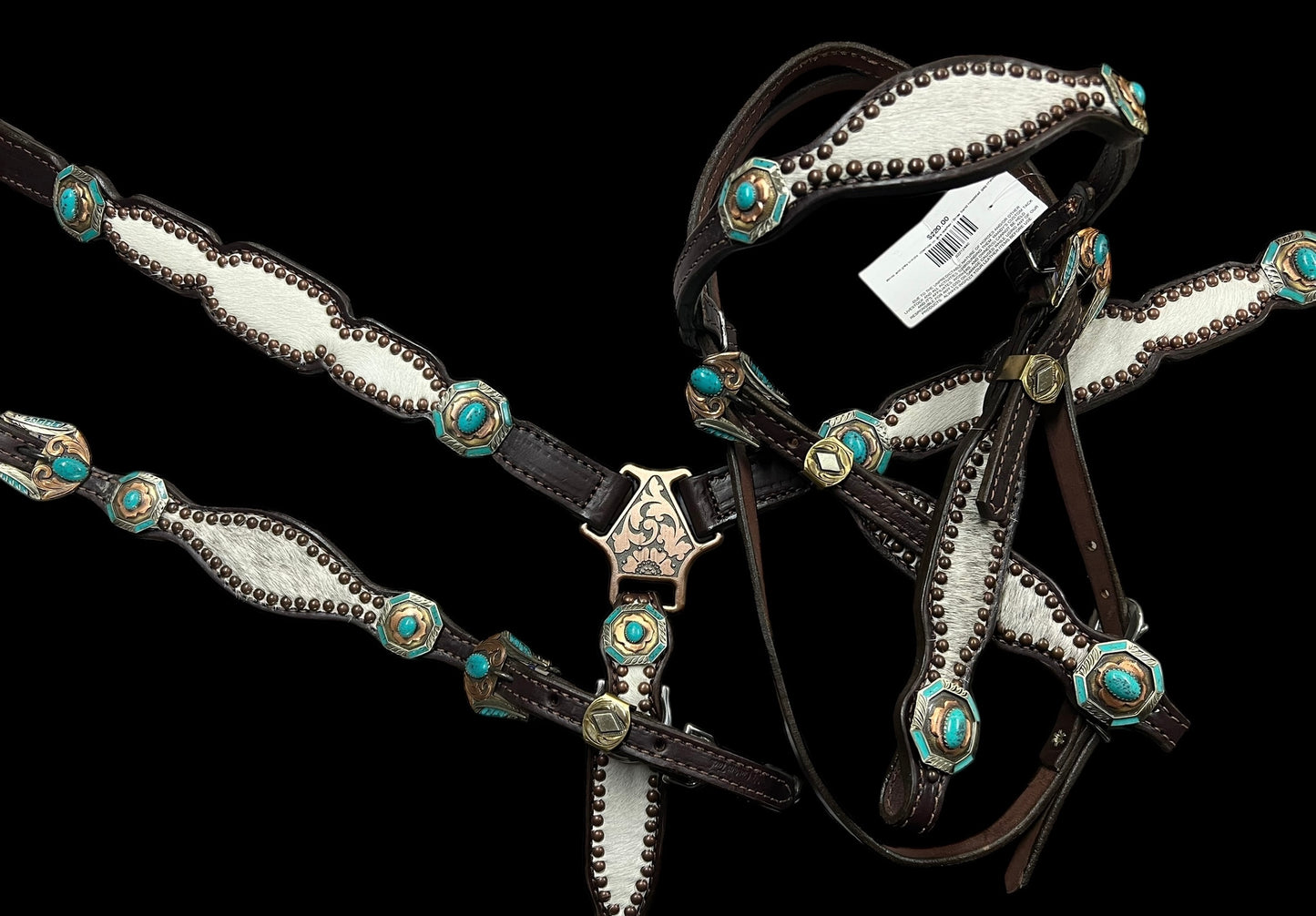 White and grey brindle  cowhide on dark leather