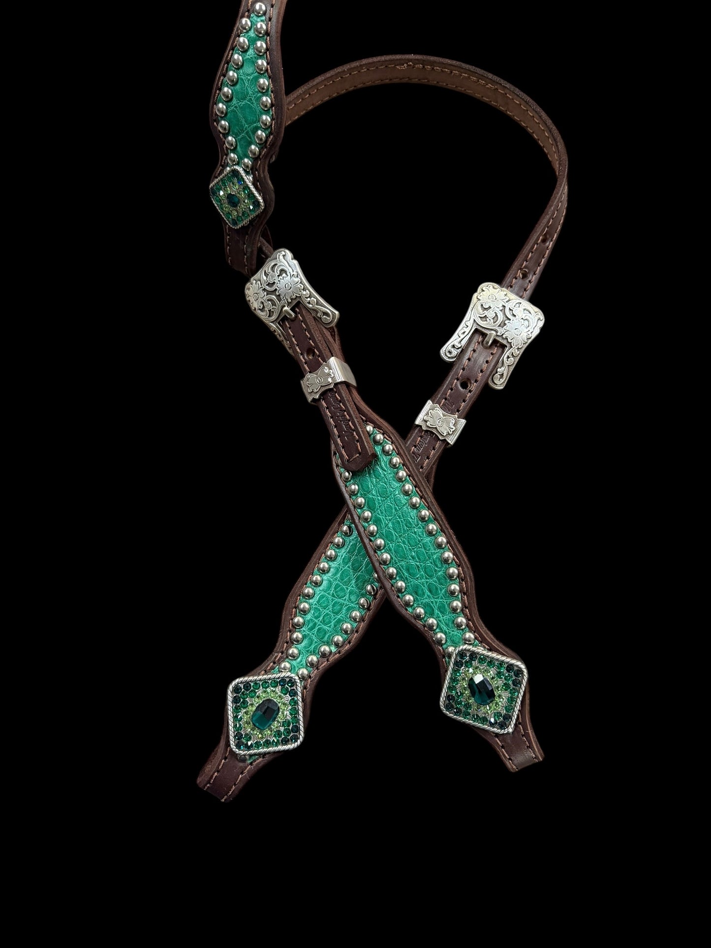 Genuine distressed green alligator on dark leather