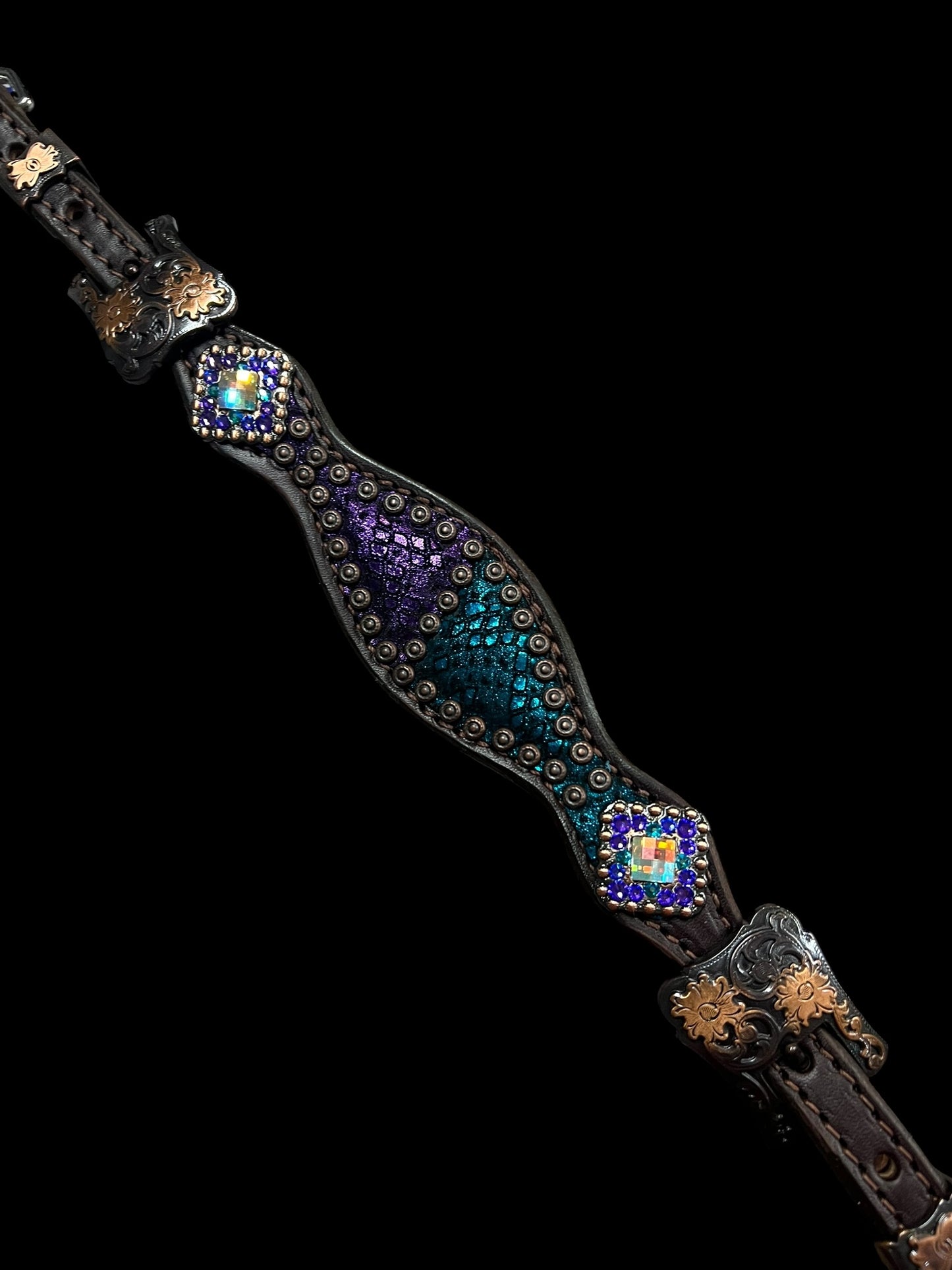 Teal and purple mystic on dark leather