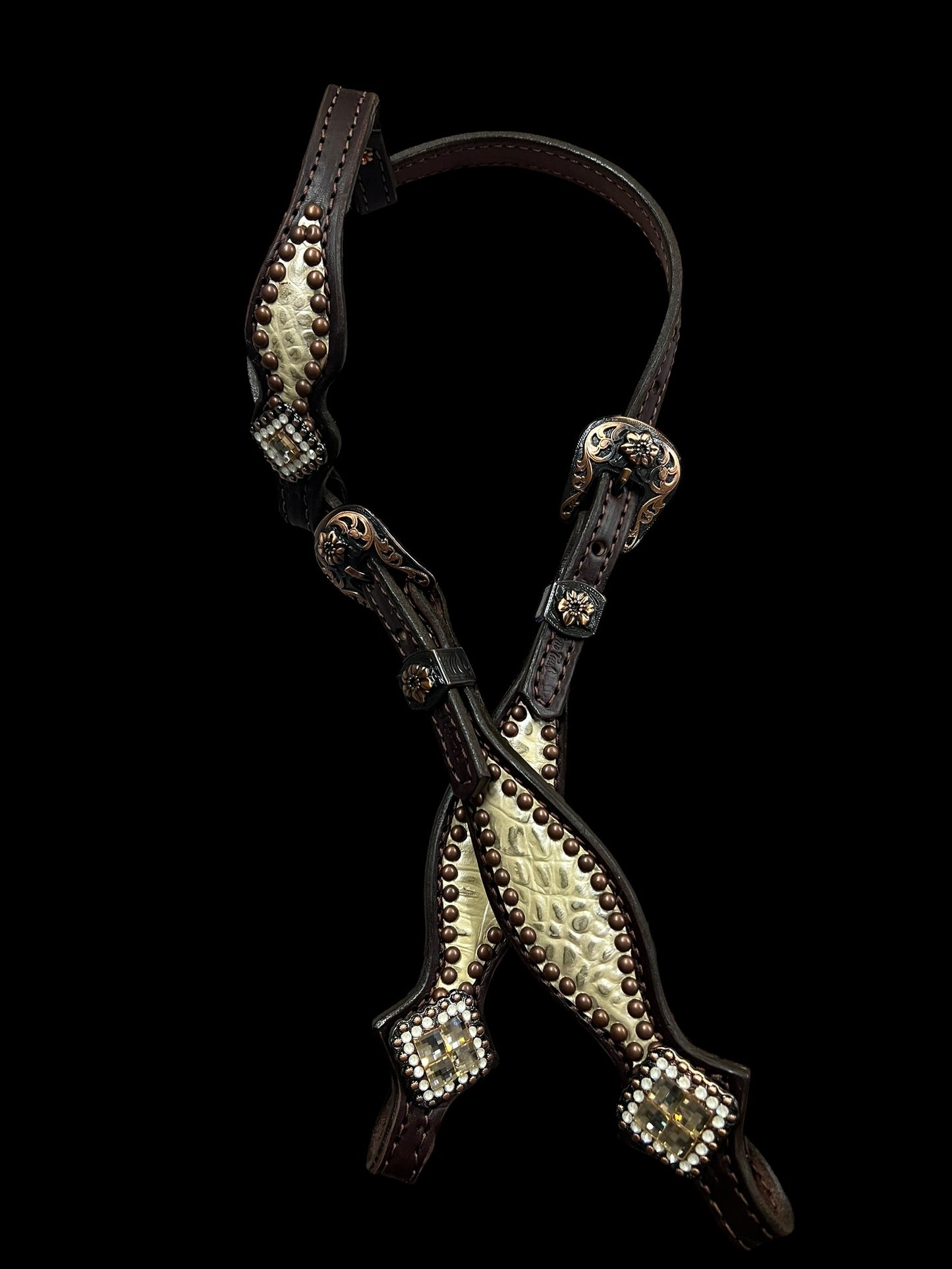 Champagne gator on dark leather