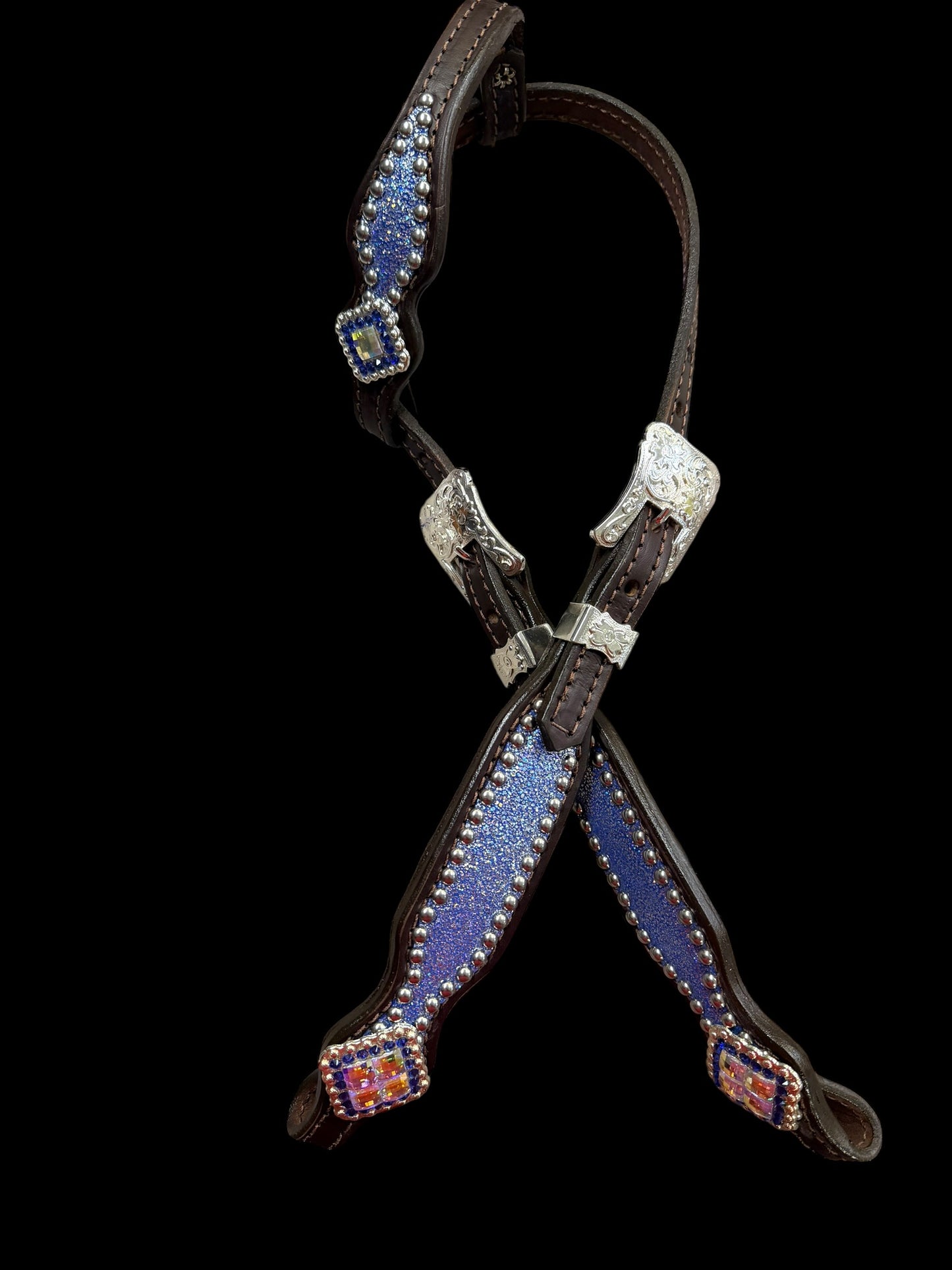 Sapphire sparkle on dark leather