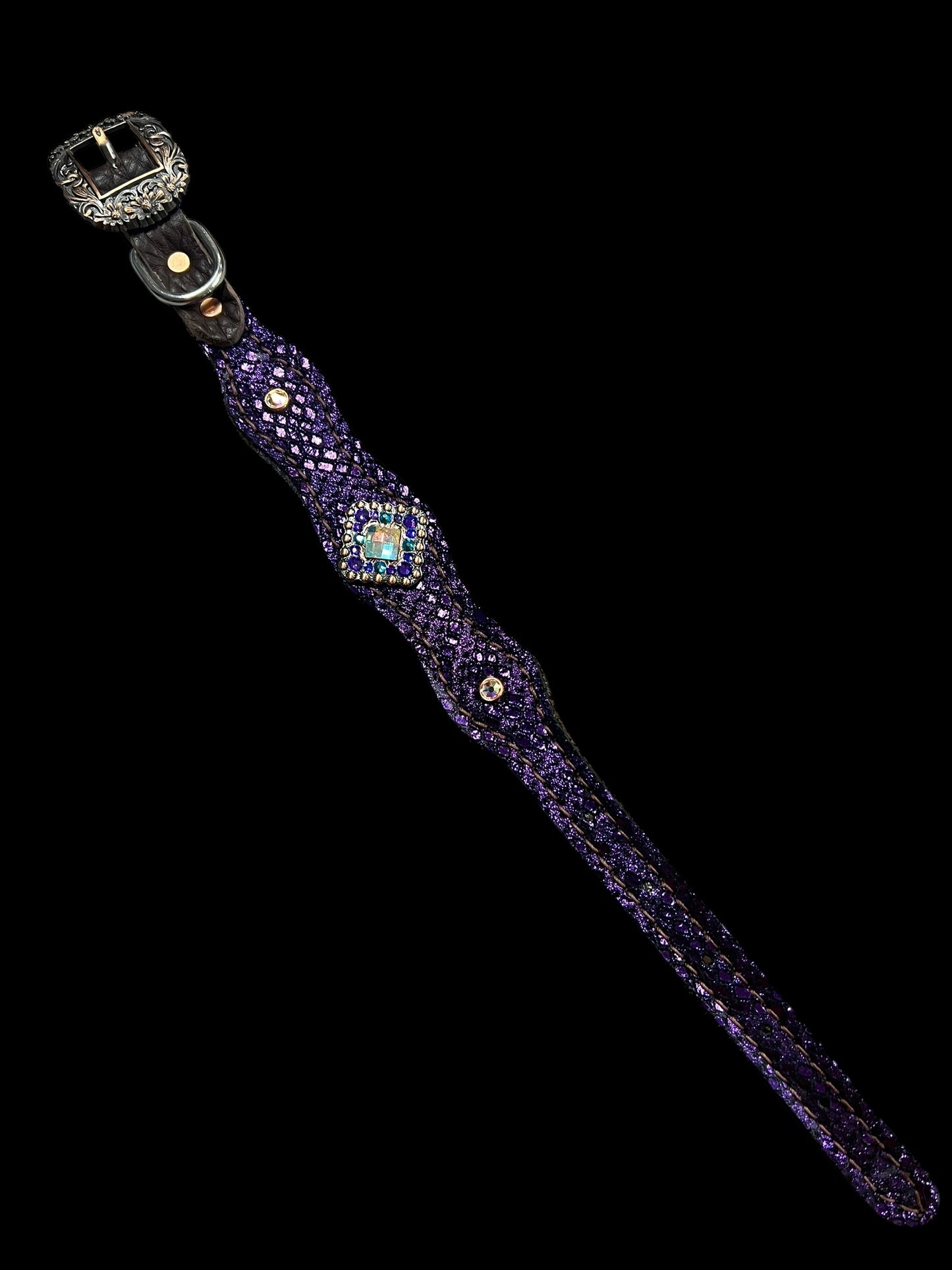 Teal and purple mystic on dark leather