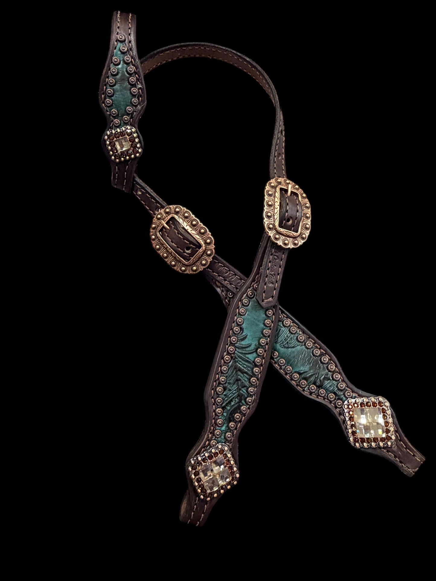 jade feathers on dark leather