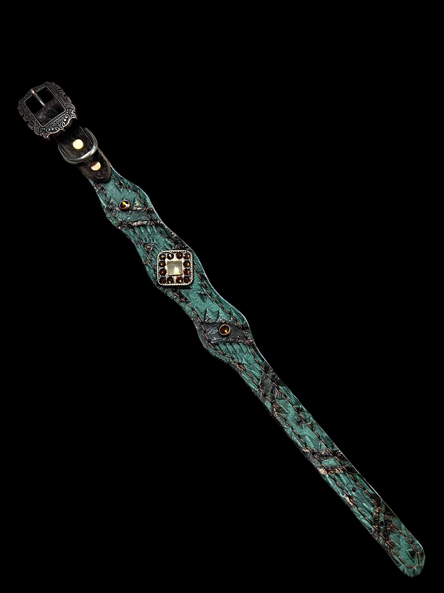 Teal and brown aztec on dark leather
