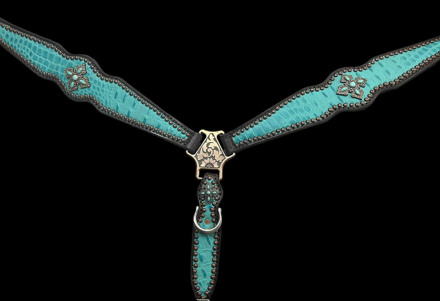 Turquoise gator on dark leather