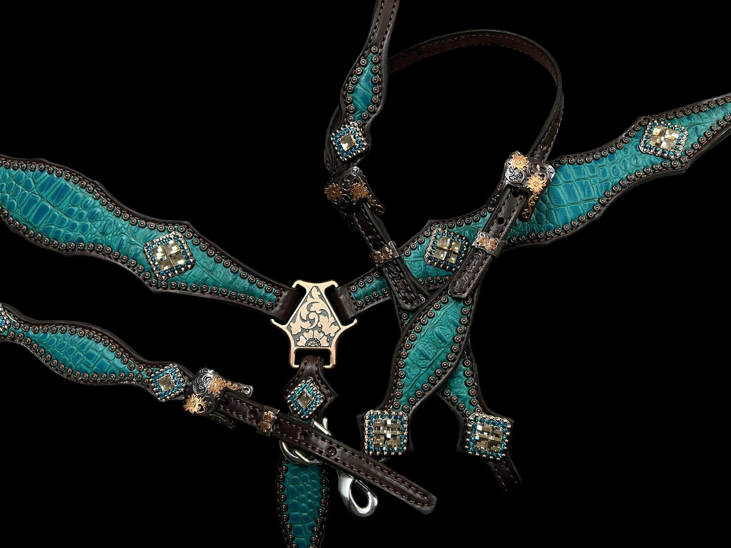 Teal gator on dark leather