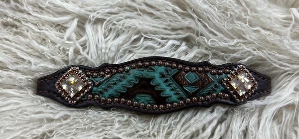 Teal and brown aztec on dark leather