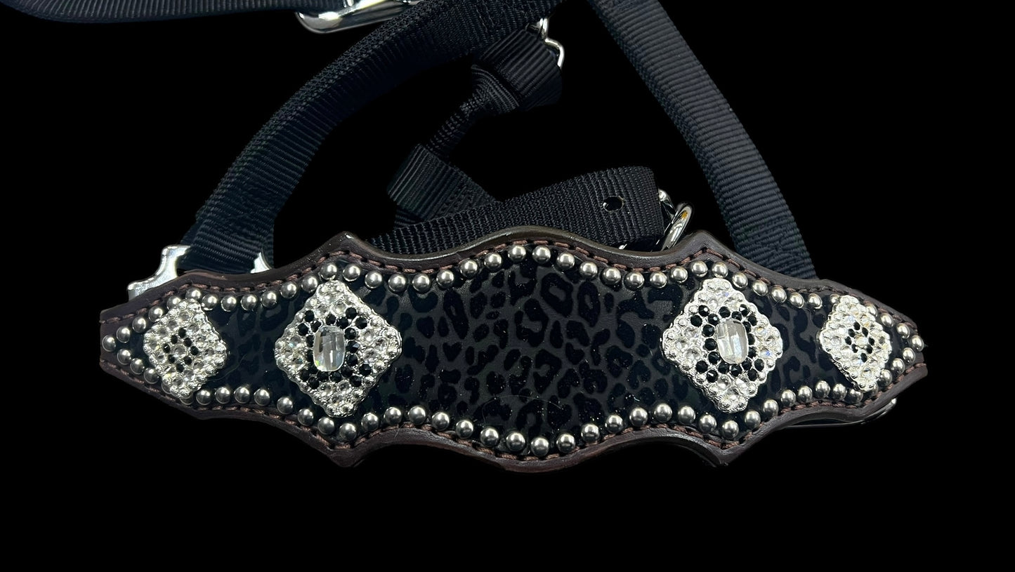 Black flocked leopard on dark leather