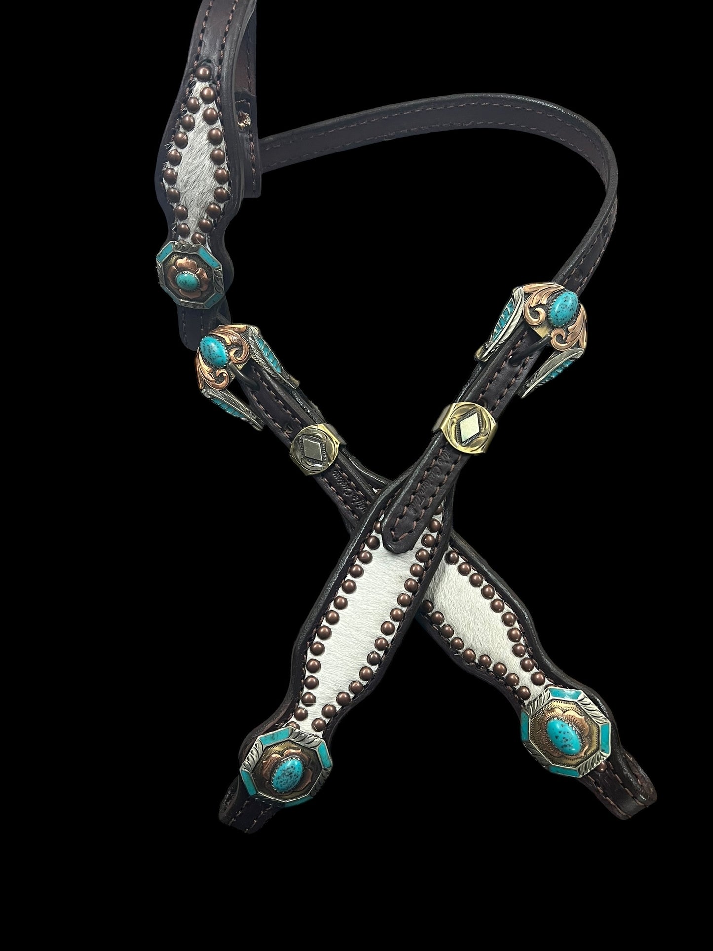 White and grey brindle  cowhide on dark leather