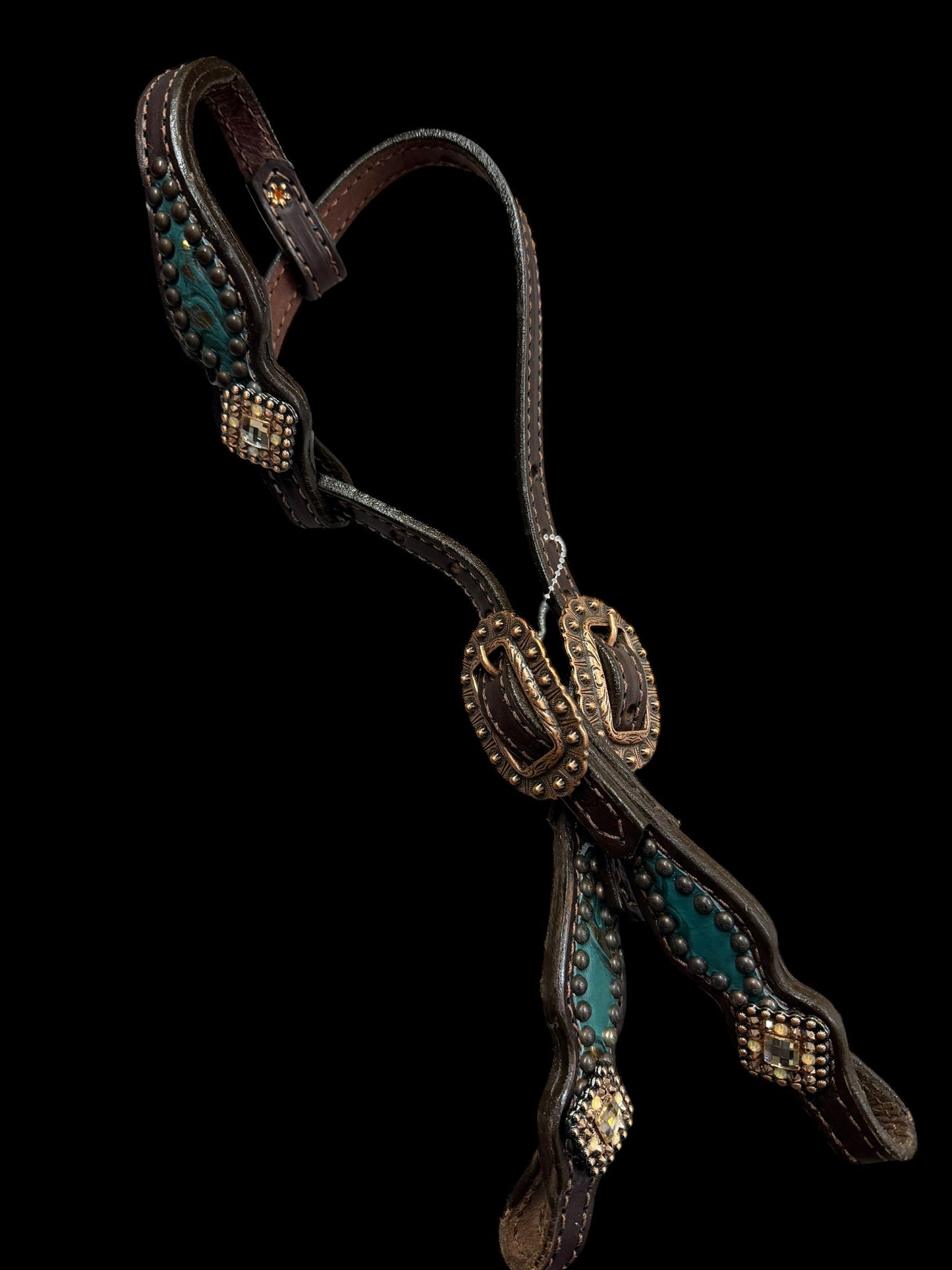 jade and copper on dark leather