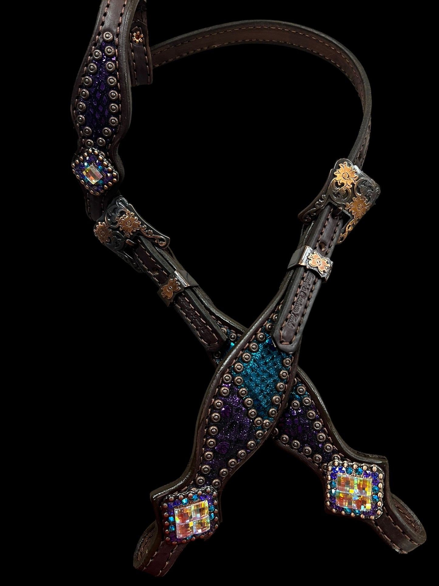 Teal and purple mystic on dark leather