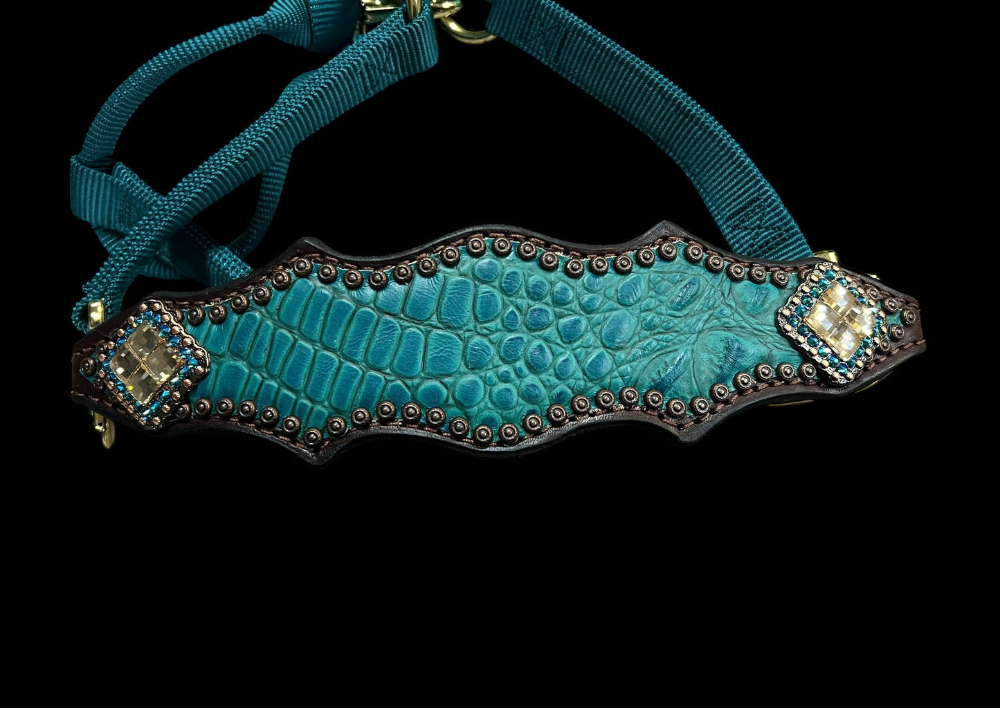 Teal gator on dark leather