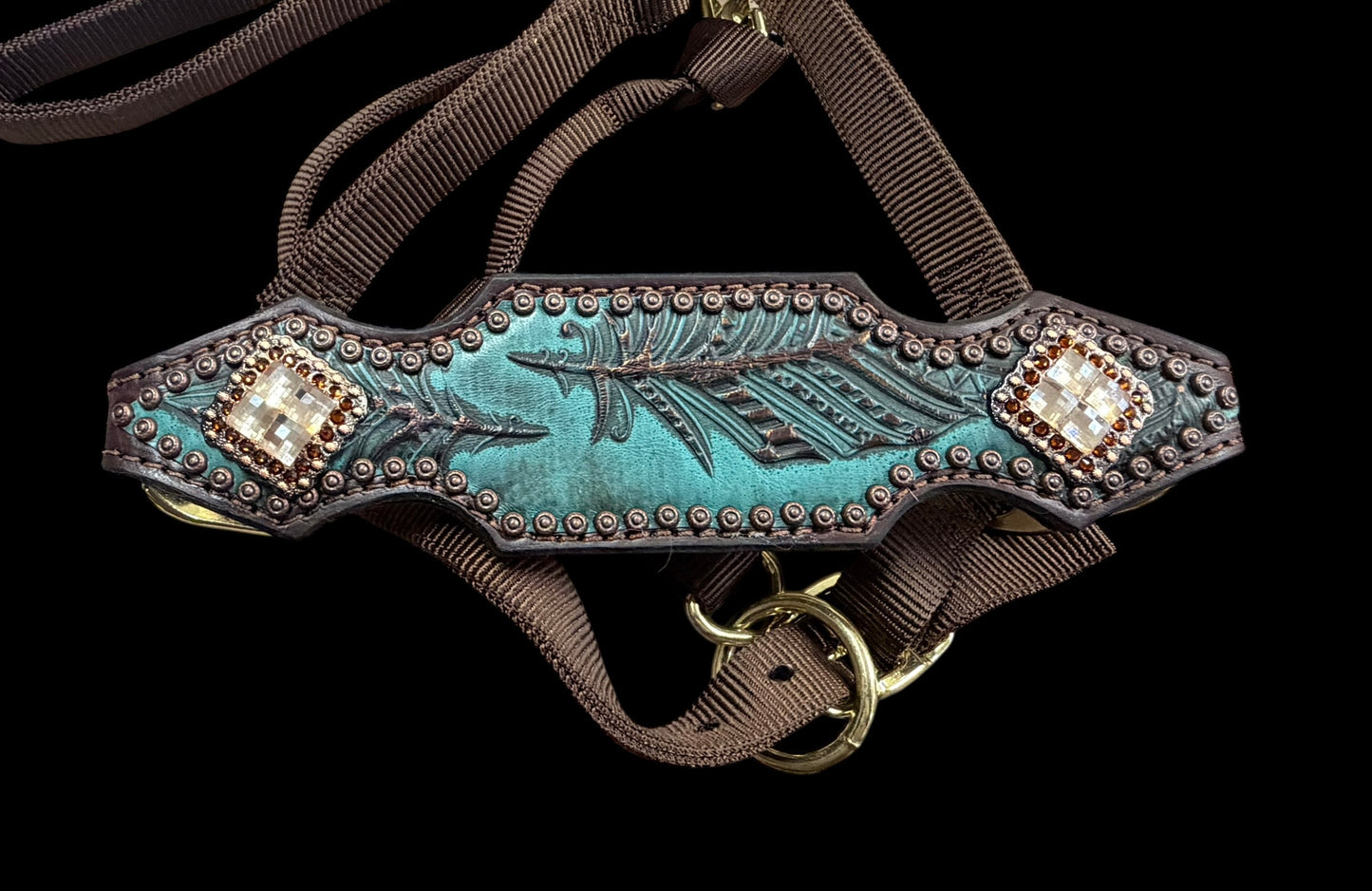 jade feathers on dark leather