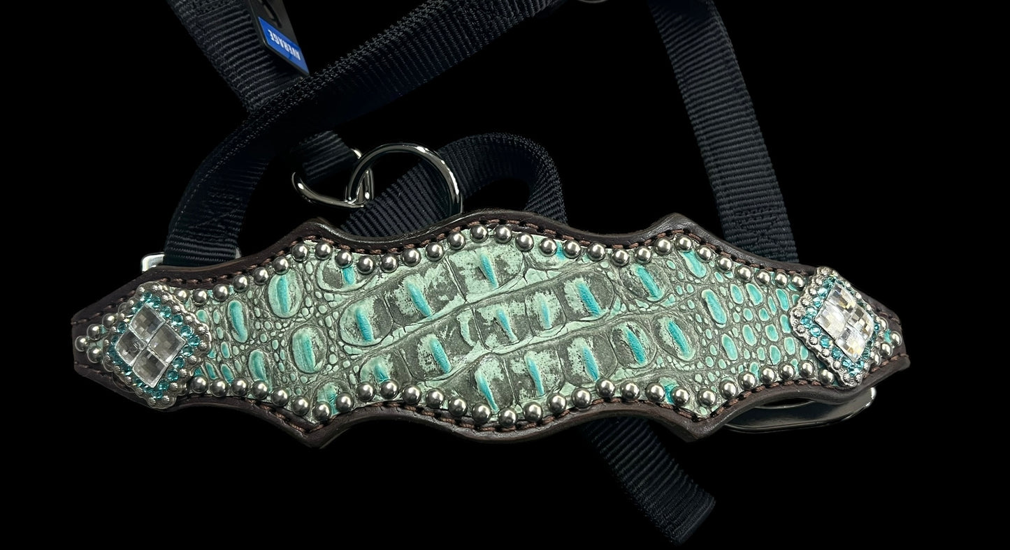 Antique turquoise gator on dark leather
