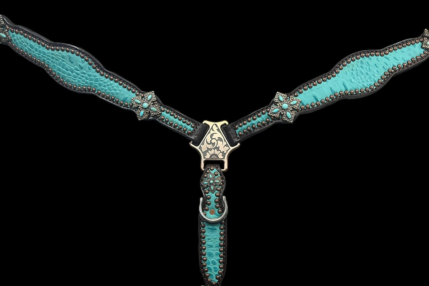 Turquoise gator on dark leather