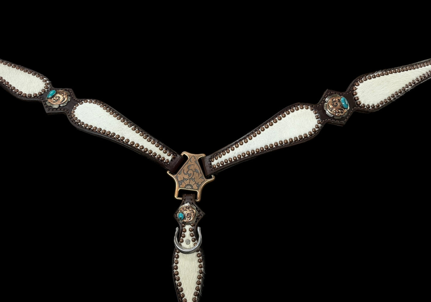 White and grey brindle  cowhide on dark leather