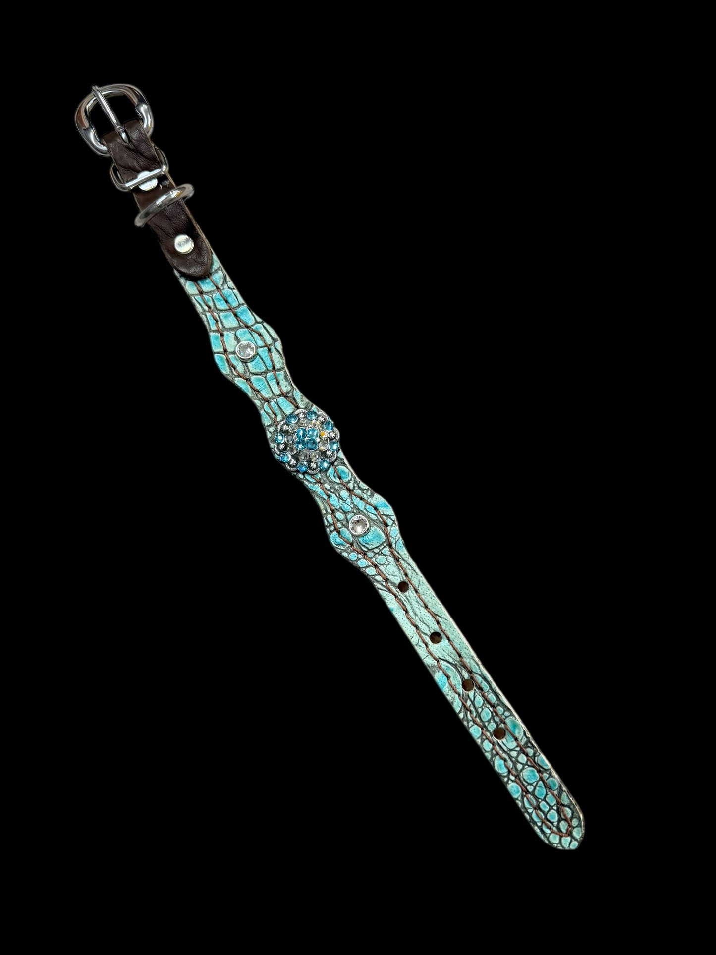 Antique turquoise gator on dark leather