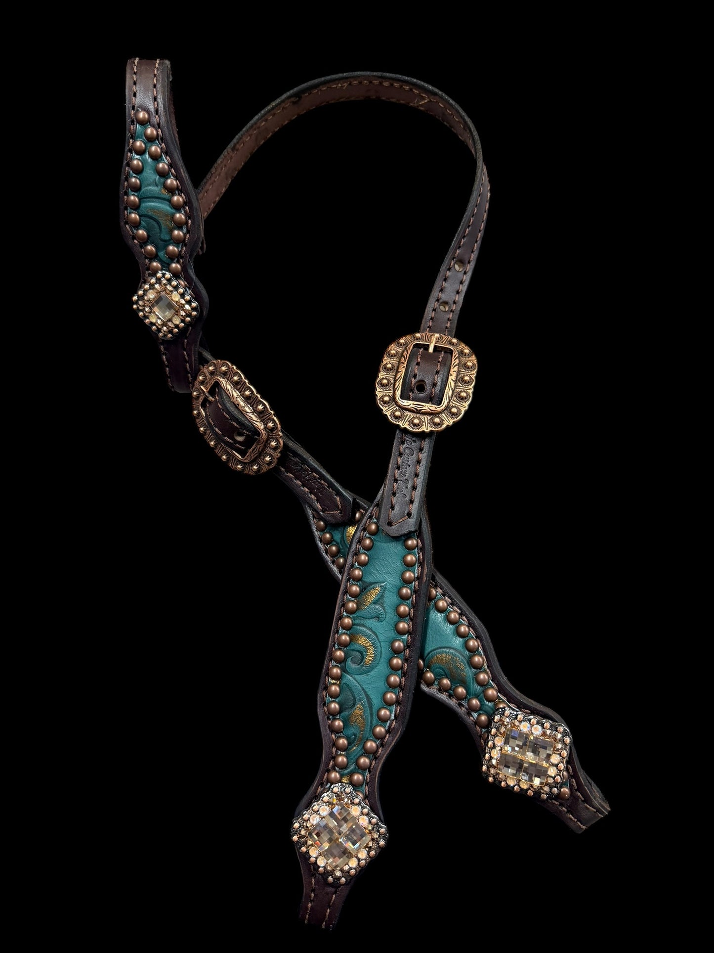 jade and copper on dark leather