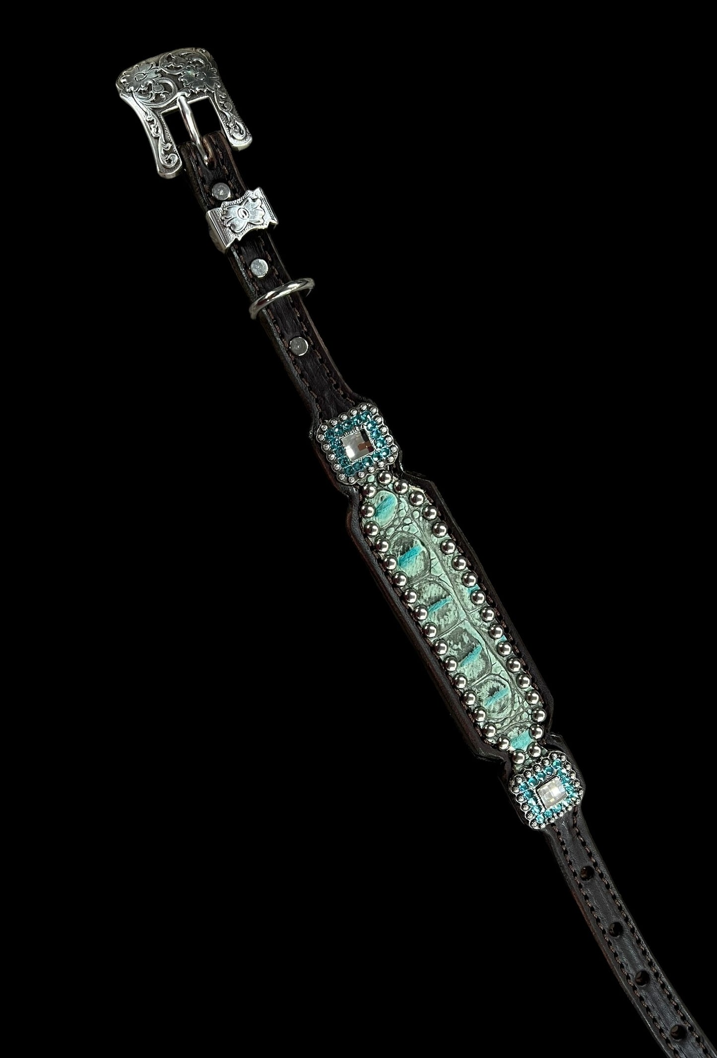 Antique turquoise gator on dark leather