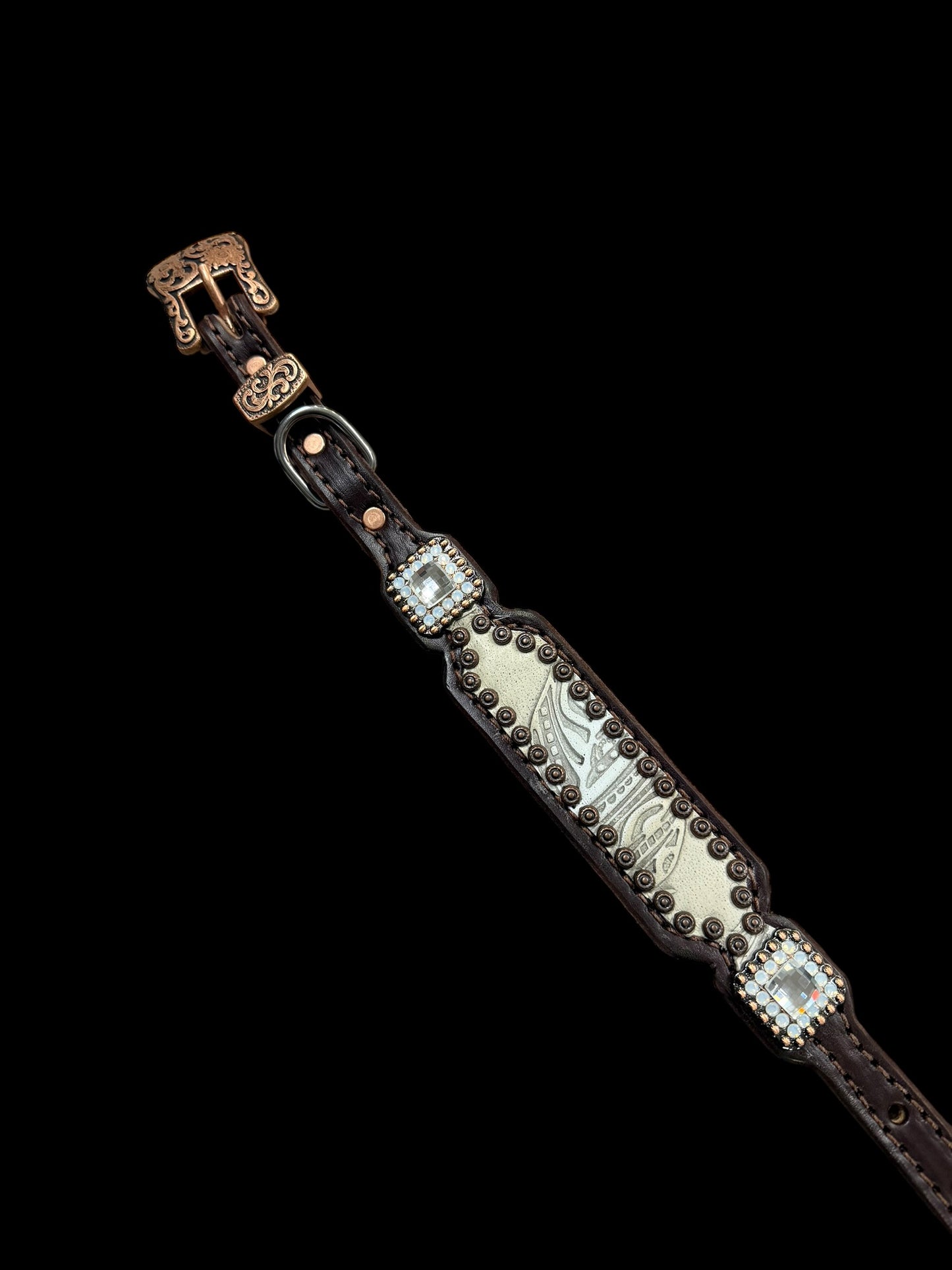 Cream feathers on dark leather