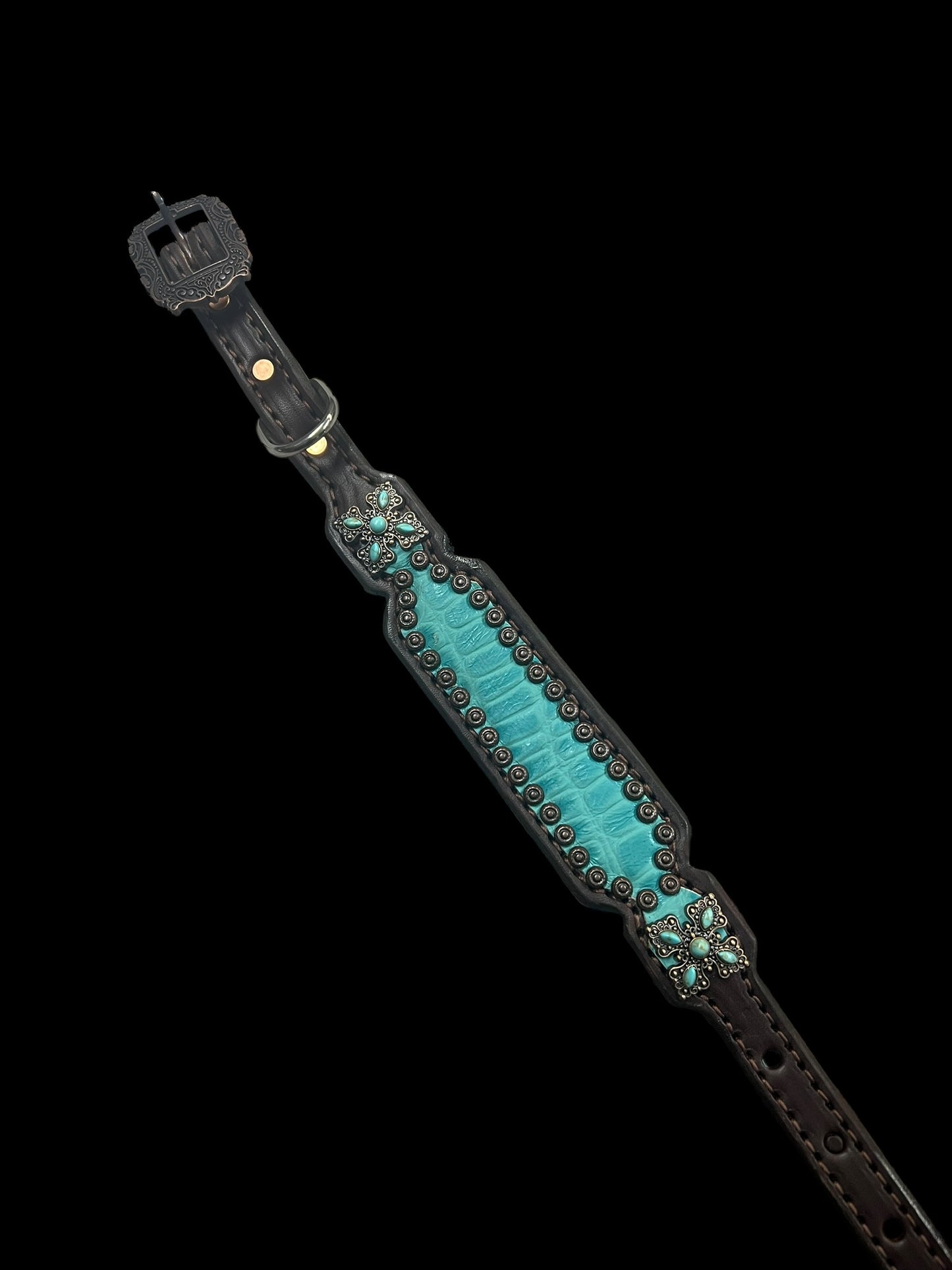 Turquoise gator on dark leather