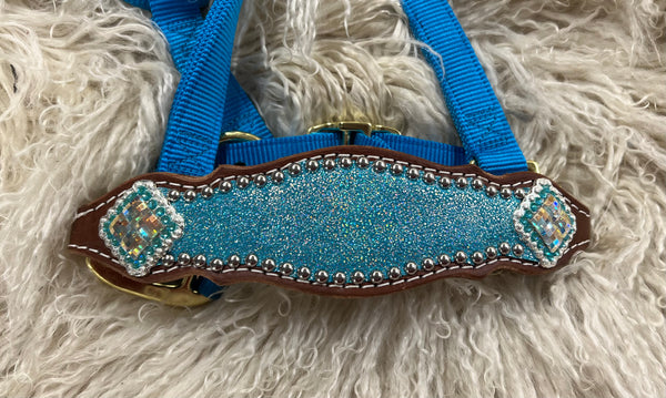Turquoise sparkle on medium leather