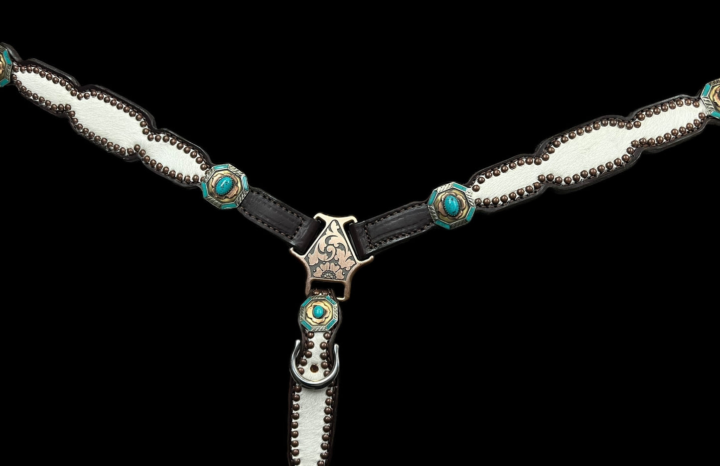 White and grey brindle  cowhide on dark leather