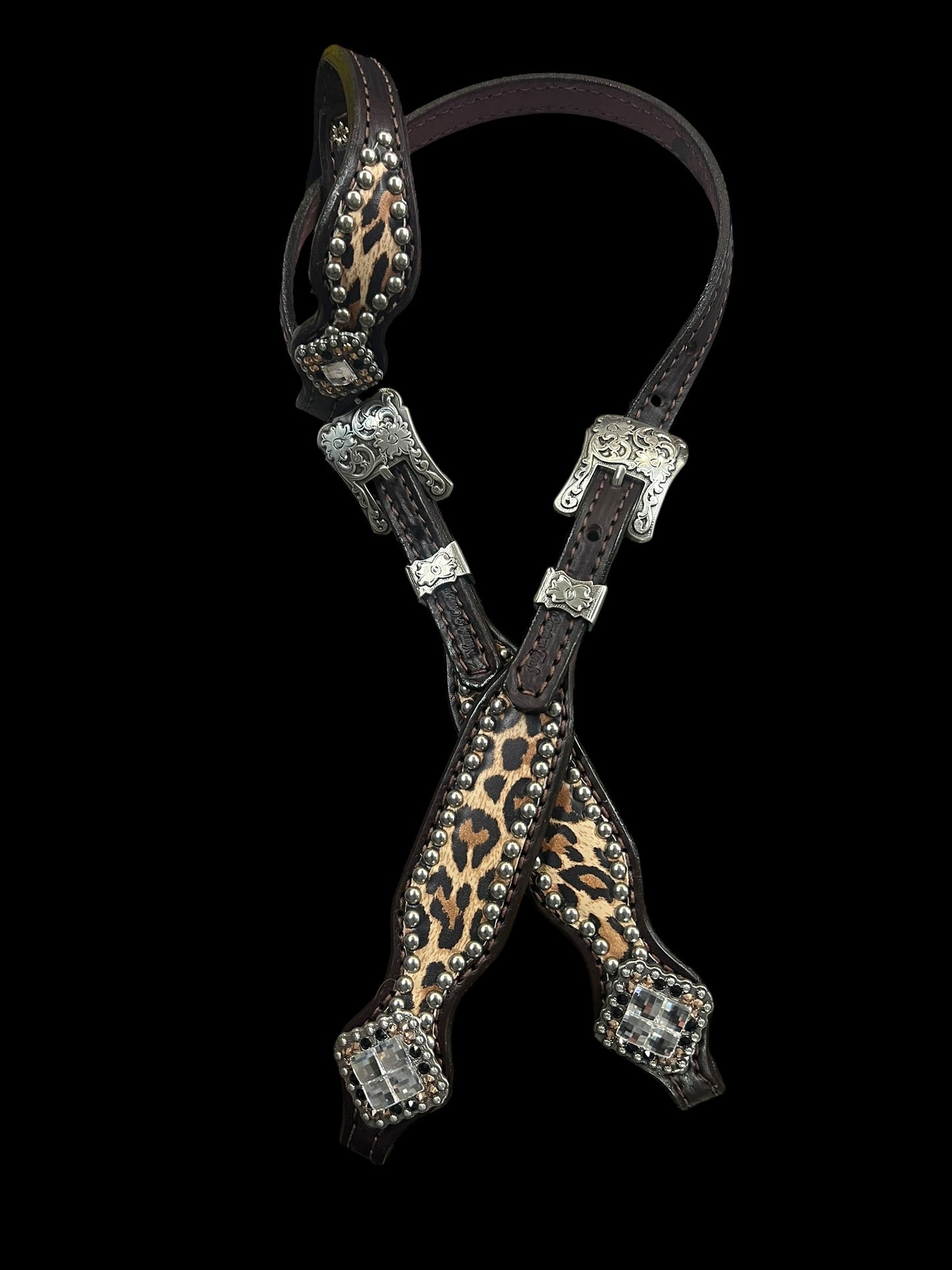 Leopard on dark leather