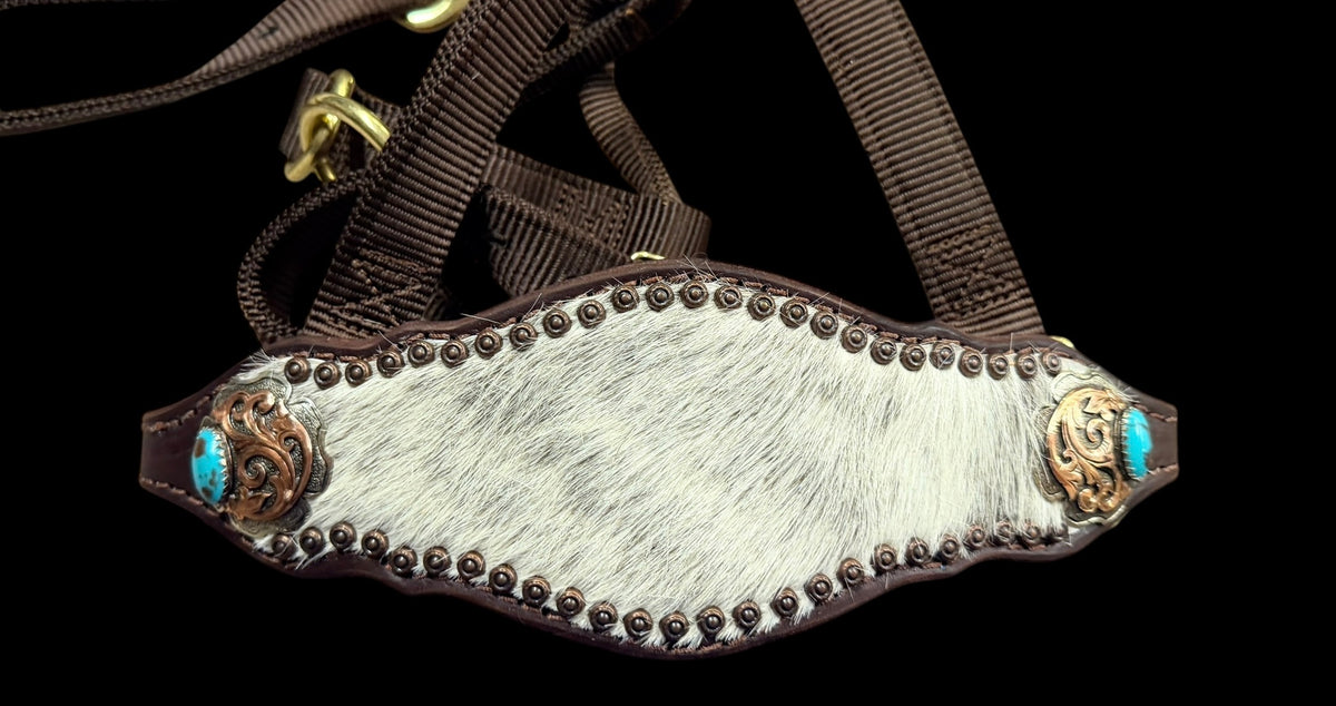 White and grey brindle  cowhide on dark leather